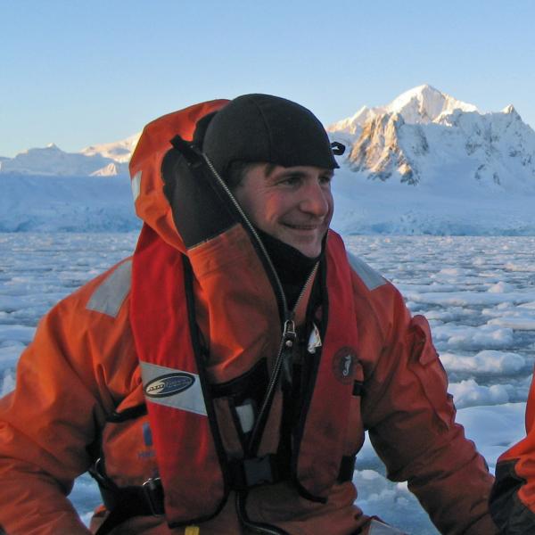 Dr. Daniel Crocker in a boat in the Arctic