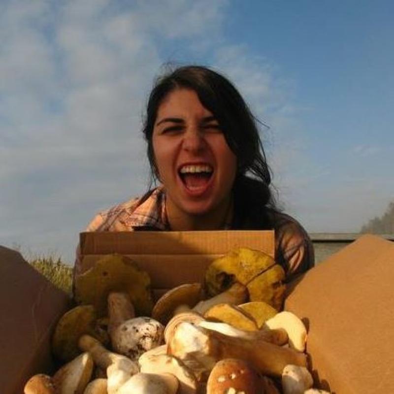 Woman with box of mushrooms