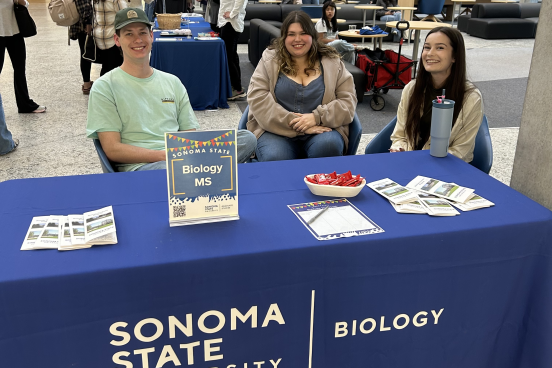Grad Studies Fair 101625 Students sitting at a table