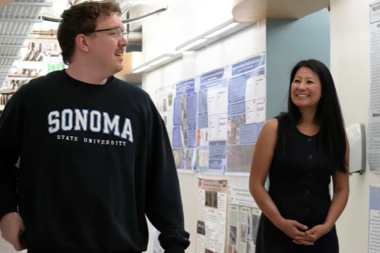 Kieran and Dr. Hua talking while walking down the hall in Darwin