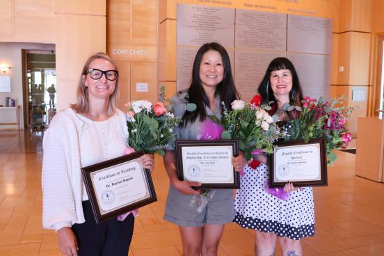 Professors holding their awards