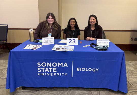 Students and faculty tabling at symposium event
